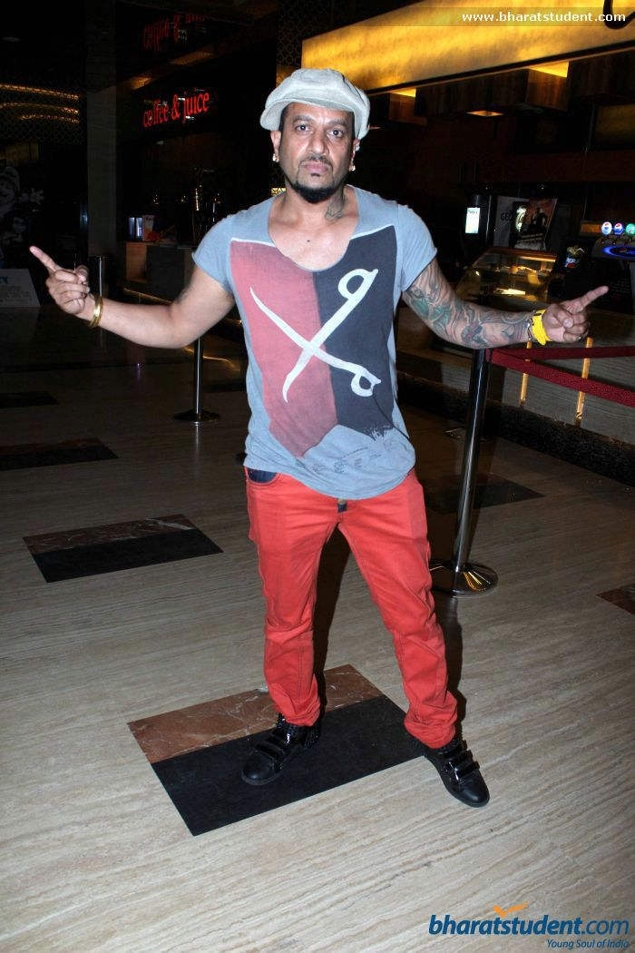 Jazzy B Wearing Orange Trouser