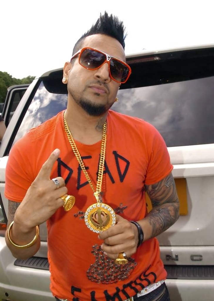 Jazzy B Wearing Orange Tshirt