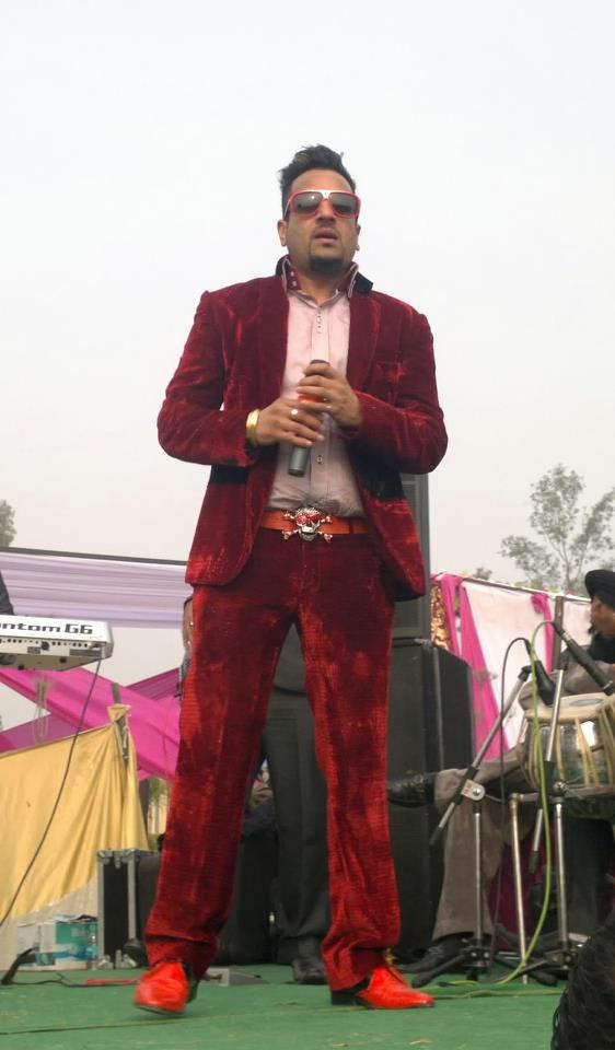 Jazzy B Wearing Red Coat