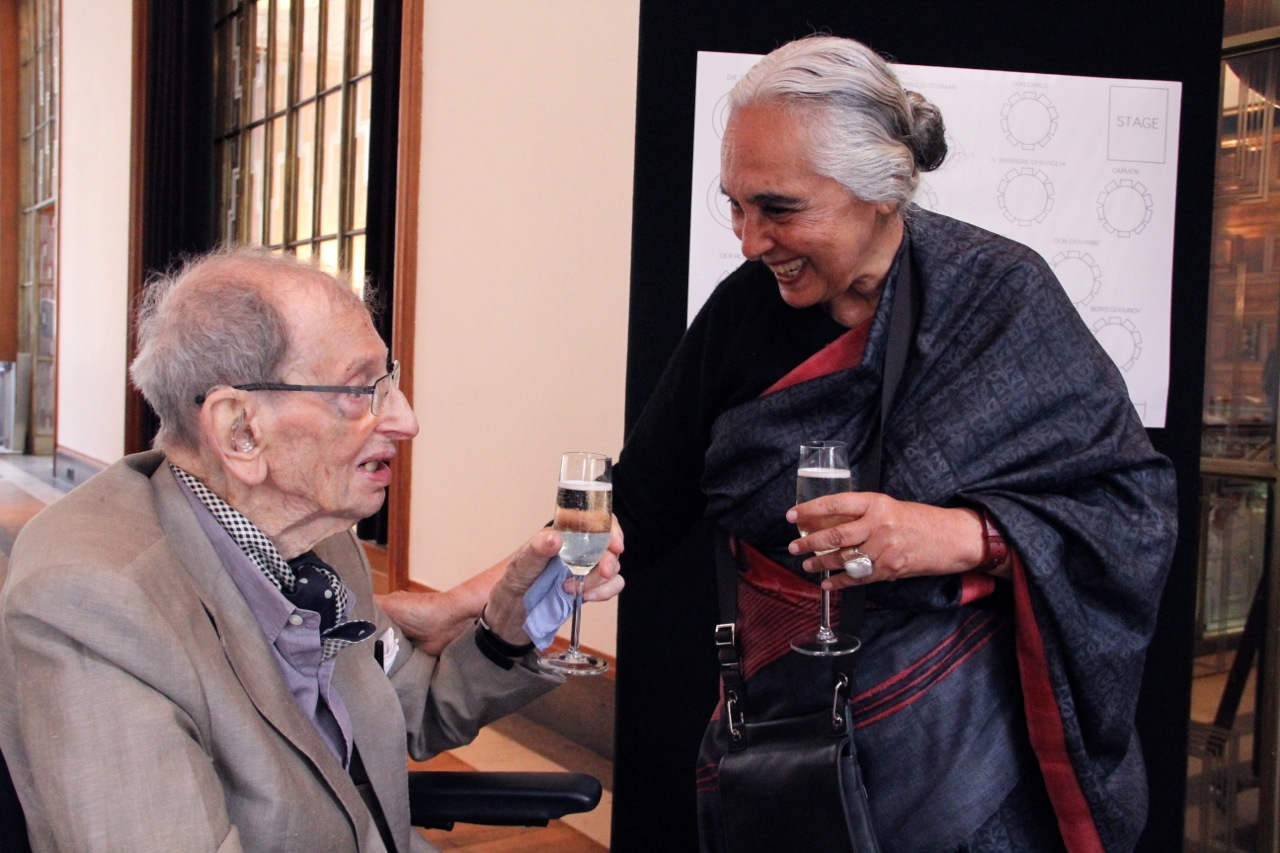 Romila Thapar Holding Glass