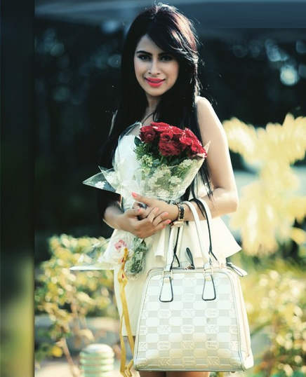 Sara Gurpal Holding Flower