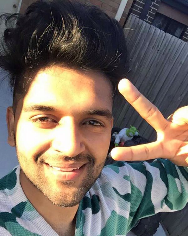 Guru Randhawa Posing Victory Sign