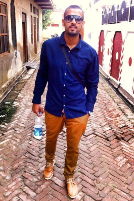 Garry sandhu In blue shirt