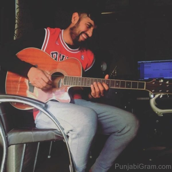 Garry sandhu playing guitar