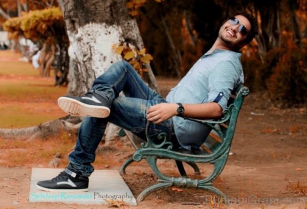 Jassi gill sitting in garden