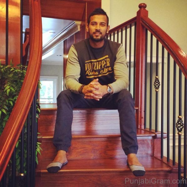 Garry Sandhu Sitting Stairs